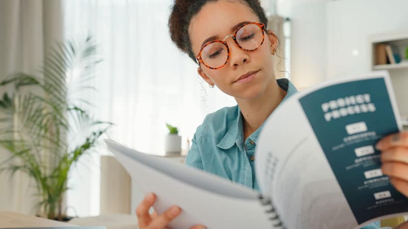Woman reading manual for Hygiene, Safety & Regulations | ESI Show